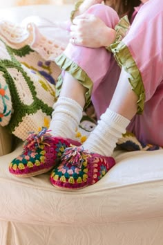 Brightly hand-dyed yarn, hand-felted and crocheted with granny squares. These slippers are sure to keep your feet stylish, warm, and happy all season long. 100% wool with leather sole. Sold in sizes XS (6-6.5), S (7-7.5), M (8-8.5), L (8.5-9), XL (10-10.5). Roomy, size down. We know slippers are bit trickier to fit than our knit hats so we are offering free exchanges to find your perfect pair. Pink Granny Square, Granny Square Slippers, Crocheted Slippers, Square Shoes, Crochet Slipper, Knit Slippers, Granny Square Crochet Patterns Free, Crochet Slipper Pattern, Crochet Leaves