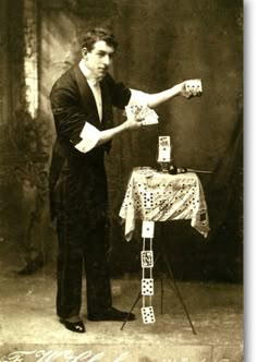 an old photo of a man playing cards