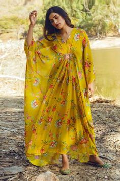 Yellow kaftan with all-over floral print, V-neckline and embellished at the waist. Comes with cotton silk inner slip. Luxury Printed Kaftan For Eid, Luxury Anarkali Set For Summer, Luxury Anarkali Style Festive Kaftan, Luxury Anarkali Kaftan Maxi Length, Luxury Anarkali Cotton Silk Kaftan, Luxury Anarkali Maxi Length Kaftan, Luxury Kaftan With Printed Motifs, Casual Maxi Dresses Indian, Luxury Bollywood Chiffon Dress