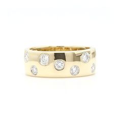 a yellow gold wedding ring with five diamonds