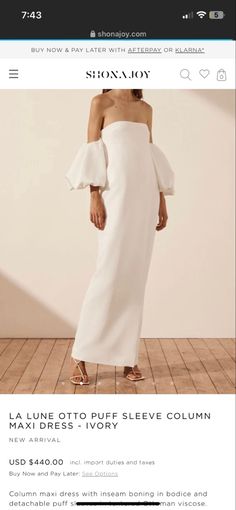 a white dress with an off the shoulder design