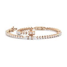 This lovely and lithe diamond bracelet is the perfect choice for someone who wants something a little bit out of the ordinary without veering too far away from tradition. It features a classic row of round diamonds interrupted by five stations that feature a larger round diamond flanked by pear diamonds. Rose Gold Diamond Bracelet With Brilliant Cut, Rose Gold Diamond Cut Bracelets, Everyday Luxury Rose Gold Diamond Bracelet With Brilliant Cut, Rose Gold Brilliant Cut Diamond Bracelet, Timeless Rose Gold Diamond Bracelet, Rose Gold Brilliant Cut Diamond Bracelet For Anniversary, Rose Gold Diamond Bracelet With Round Cut, Dazzling Rose Gold Diamond Cut Bracelets, Dazzling Rose Gold Bracelets With Diamond Cut