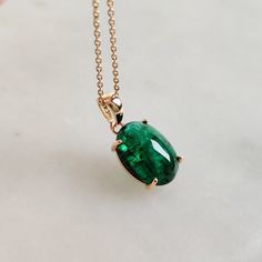 This stunning pendant is set in 14k Solid Yellow Gold with Natural Zambian Emerald with utmost precision. It is an unique gemstone pendant for nearly every occasion and is completely hassle-free jewelry. ITEM DETAILS: * Gem: Emerald * Gem Size: 9x12.5 mm * Gem Shape: Oval * Gem Weight: 4.05 carats * Gold Purity: 14KT * Gold Weight: 0.70 gram * Total Weight of the Pendant: 1.51 gram The Gold purity is guaranteed and it comes with authentic 14KT gold hallmark. Since my items are handmade, they are Timeless Emerald Necklace With 17 Jewels For Gift, Elegant Cabochon Necklace For May Birthstone, Oval Large Pendant Jewelry For Anniversary, Elegant Custom Necklace With Large Pendant As Gift, Exquisite Emerald Cut Gemstones For Gift, Exquisite Bezel Set Jewelry Gift, Timeless Emerald Necklace As Gift, Fine Jewelry Cabochon Gemstones For Gifts, Fine Jewelry Cabochon Gemstones As Gift