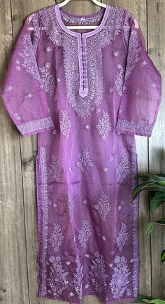 Purple Chikankari kurta on organza! Delicate hand embroidery and mukaish add ons on lightweight sheer fabric. Includes a shantoon liner. Length- 47 inches Long Sleeve Organza Kurta For Festivals, Embroidered Long Sleeve Traditional Wear In Organza, Festive Organza Traditional Wear With Chikankari Embroidery, Embroidered Long Sleeve Organza Traditional Wear, Long Sleeve Embroidered Organza Traditional Wear, Organza Kurta With Resham Embroidery For Diwali, Traditional Organza Kurta With Intricate Embroidery, Traditional Long Sleeve Organza Wear With Chikankari Embroidery, Purple Organza Set With Chikankari Embroidery