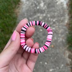 A pink and black clay bead bracelet wich is designed to fit young girls and teens!! Cheap Pink Polymer Clay Beaded Bracelet, Hot Pink Clay Bead Bracelet, Playful Pink Adjustable Stretch Bracelet, Playful Adjustable Pink Stretch Bracelet, Fun Pink Stretch Bracelet For Friendship, Pink Round Beads Bracelets, Fun Style, Pink Fun Bracelets With Round Beads, Fun Pink Bracelets With Round Beads, Cute Pink Beaded Plastic Bracelets