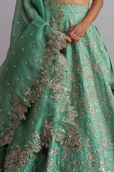 Sea-green organza lehenga with cutdana work, floral motifs and cutwork hem. Comes with embellished blouse and dupatta.
Components:3
Embroidered
Neckline:Square
Sleeve Length:Half
Fabric:Organza
Color:Green
Kamar tassels
Tie-up cutout back
Cutwork detail
Note: Cancan worn by the model is not for sale - Aza Fashions Cutdana Work, Embroidery Square, Lehenga Dupatta, Organza Embroidery, Anushree Reddy, Organza Lehenga, Embellished Blouse, Embroidered Neckline, Bridal Lehenga