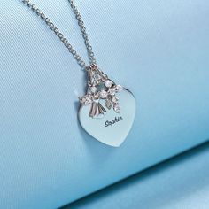 If you're looking for a meaningful gift for a young girl that can be engraved to mark her initials or a special life event, then look no further! This heirloom, engravable heart charm necklace is as special as it gets. Adorned with a protective cubic zirconia guardian angel charm and cross, this personalized heart charm for young girl's is simply perfect. Every part of this necklace set is hand crafted in genuine 925 sterling silver, making it hypoallergenic and suitable for children & teens wit Personalized Initial Pendant Charms For Gifts, Personalized Initial Pendant Charms As Gift, Heart Charm Nameplate Jewelry Gift, Silver Birthday Name Necklace With Heart Charm, Birthday Silver Name Necklace With Heart Charm, Personalized Stainless Steel Heart Necklace, Personalized White Gold Charm Necklaces For Personalized Gift, Heart Shaped Engraved Charm Necklaces For Keepsake, Heart-shaped Engraved Charm Necklaces For Keepsake