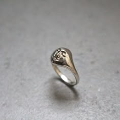 Moonface signet ring for women or for men. Size: made to order, please check your size with a proper jewelry tool or in a jewelry store. This ring is made in silver 925, but you can order it in 18K gold.  You can find some other rings from the same collection here:  https://www.etsy.com/listing/888180722/moon-face-ring-signet-unisex-ring?ref=shop_home_active_35&frs=1 The face necklace : https://www.etsy.com/listing/900846011/silver-face-pendant-moon-necklace?ref=shop_home_active_4&pro=1&frs=1 This ring is available also in 18K gold. Depending on your size, the price will be between 732- 850 euros. Don't hesitate to contact me. Silver Ring Signet, Moon Face Ring, Casted Rings, Signet Jewelry, Silver Vintage Rings, Signet Ring Silver, Signet Rings Women, Rings Men, Face Ring