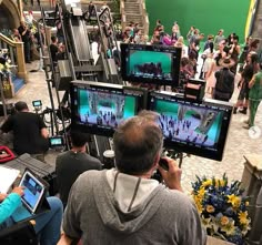 people are watching televisions in a mall