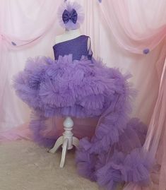 💜✨ Unveil your little one's elegance with our stunning Lilac One Shoulder Flower Girl Dress, designed specifically for special birthday events and parties. Crafted from premium-quality fabric, this dress features a long tail and a striking purple hue that will undoubtedly make her stand out. The one-shoulder design adds a modern twist to a classic silhouette, perfect for adding a touch of glamour to any event. 📐Measuring accurately to your child's size, this gown ensures a comfortable fit while allowing ease of movement, making it perfect for dancing and playing. The materials used are soft to the touch to avoid skin irritation, and the craftsmanship reflects meticulous attention to detail. The dress is available in multiple sizes to cater to your growing princess. 🪶 To maintain the pri Purple Tulle Party Gown, Purple Tulle Gown For Party, Elegant Purple Tutu Dress For Party, Purple Ruffled Gown For Pageant, Fitted Tulle Ball Gown For Birthday, Purple Princess Style Party Gown, Purple Ball Gown Princess Dress For Party, Elegant Organza Princess Dress For Birthday, Purple Tulle Princess Dress For Party