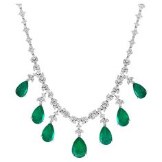 GIA Certified Pear Zambian Emerald & Diamond Bridal Drop Necklace 14 Karat white Gold 14 karat white gold natural Zambian and diamond necklace, consisting of 7 Pear shape Emeralds with a total carat weigh of 35 carats, with round brilliant cut round diamonds .All prong set and dangling from a 16 inch diamond necklace, consisting of 3 groups of diamonds, with a total carat weight of 14 carats, F-G Color, VS1, VS2 clarity with no color enhancement. One randomly piece 1st closest to center was give Luxury Pear-shaped Emerald Necklace In White Gold, Luxury Pear-shaped White Gold Emerald Necklace, Luxury Pear-shaped Gemstone Necklace, Zambian Emerald, Dream Jewelry, Drop Necklace, Gold Jewelry Fashion, Emerald Diamond, High Jewelry