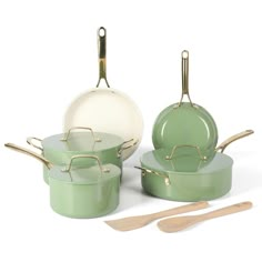 green pots and pans with wooden utensils