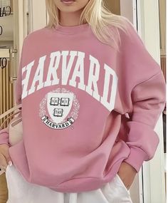 The Harvard Sweatshirt is not just a statement of collegiate style; it's a testament to comfort. Crafted with a soft and cozy fabric, this pullover ensures a luxurious feel, while its true-to-size fit guarantees that you can effortlessly showcase your Harvard pride in comfort and style. Measurements (based on flat lay): Small - Chest 21.5" Length 26" Medium - Chest 22.5" Length 26.5" Large - Chest 23.5" Length 27" Fabric: 100% Polyester Harvard Sweatshirt, Pink Sweatshirt, Clothing Size Chart, Womens Clothing Sizes, Print Pullover, White Sweatshirt, Casual Sweatshirt, Long Sleeve Casual, Long Sleeve Sweatshirts