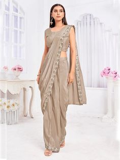 Elevate your festive and party wardrobe with our Elegant Beige Ready-To-Wear Tussar Silk Saree, a masterpiece of sophistication and charm. Crafted from luxurious tussar silk, this saree offers a blend of comfort and style, ensuring you look stunning at any occasion. LEGAL DESCRIPTION: There Might Be Minor Colour Variation Between the Actual Product And the Image Shown On Screen Due To Lighting in the Photography.