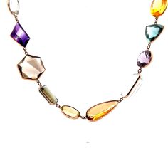 Multi-Gemstone Necklace in 14k Yellow Gold This exquisite modern necklace is crafted from 14 karat yellow gold, creating a luxurious and elegant piece that is sure to spark a conversation. The long piece features a series of multi-gemstone bezel set stones, with a total of 91.52 carats of citrine, 89.96 carats of aquamarine, 80.66 carats of quartz, 79.55 carats of amethyst, 41.31 carats of tourmaline, and 10.20 carats of topaz.  The perfect combination of modern design and luxurious gemstones, t Modern Gold Multi-stone Gemstones, Exquisite Multi-stone Necklace For Formal Occasions, Luxury Multi-stone Necklaces For Formal Occasions, Luxury Formal Multi-stone Necklace, Modern 14k Gold Multi-stone Jewelry, Formal White Gold Multi-stone Necklaces, Formal White Gold Multi-stone Necklace, Modern Gold Multi-stone Jewelry, Faceted Gemstones In 14k Gold For Formal Occasions