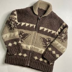 Vintage Hand Knit 100% Wool Cowichan Siwash SweaterApprox Sz: S/M (No tag, please see measurements)Condition: Overall excellent pre-owned condition. Zips up and down perfectly. No stains, snags or holes. Very thick, heavy weight knit. Smoke free home. Pet friendly home. Rare find at this size.Approx MeasurementsPit to Pit 19"Collar to Bottom 26" Cozy Wool Jacquard Knit Outerwear, Cozy Wool Outerwear With Jacquard Knit, Cozy Jacquard Knit Outerwear For Cold Weather, Brown Knitted Winter Outerwear, Brown Wool Jacquard Knit Outerwear, Cold Weather Wool Outerwear With Jacquard Knit, Cozy Brown Outerwear With Fair Isle Pattern, Brown Long Sleeve Knit Outerwear, Nordic Style Outerwear For Fall