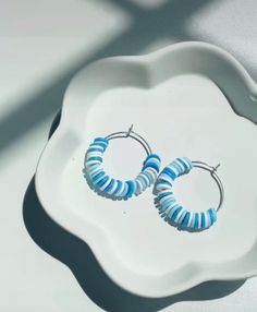 blue and white dangling hoop earrings perfect for summer Blue Everyday Jewelry For Summer, Blue Everyday Summer Jewelry, Everyday Blue Summer Jewelry, Blue Small Hoop Earrings For Summer, Blue Hoop Jewelry For Summer, Blue Hoop Jewelry For The Beach, Blue Hoop Earrings For Summer, Blue Hoop Earrings With Round Beads For Beach, Blue Hoop Earrings As Summer Gift