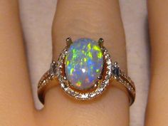 Solid 14k Yellow Gold Ring with one Natural Opal surrounded by natural diamonds. This Black Opal is from Lightning Ridge , Australia. It is 100% Natural and not a doublet or triplet. Please Note: The opal is not set as of yet.  Prongs will be filed down to size and the Opal will be set once I know your ring size. Regards Jason GOLD WEIGHT: 3.1 grams Solid 14k Yellow Gold OPAL SIZE:  10.3 x 7.2 x 3.8 mm OPAL WEIGHT :   2.0 ct. COLORS:     Green and Gold PATTERN:    banded / confetti   BRIGHTNESS: Black Opal Fine Jewelry, Luxury Polished Opal Ring Fine Jewelry, Weird Accessories, Black Opal Jewelry, Opal Diamond Ring, Black Opal Ring, Flawless Diamond, Insect Jewelry, Real Jewelry