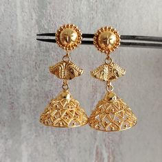 This is a beautiful 22k Real Gold pair of jhumka Earrings .  This is the perfect gift for mom, wife, fiancée, girlfriend, valentine, daughter, family or friend. It is a special gift for mother's day, valentine's day, wedding, anniversary, birthday, Christmas, Easter, New Year's and any holiday. 1. Material Details ✫ Gold : 22K (Real Gold) ✫ Gold Color Options: Yellow Gold ✰ Shape: floral ✰ Color: Yellow ✰ Weight:  10.196 grams approx. Terms & Conditions If there is any change. We request buyer t 22k Gold Dangle Jhumkas For Festive Occasions, 22k Gold Jhumkas With Latkans For Navratri, 22k Gold Chandbali Danglers With Latkans, Gold Chandbali Bridal Earrings For Puja, Festive 22k Gold Dangle Jhumkas, Festive 22k Gold Jhumkas With Latkans, Gold Danglers For Puja And Festive Occasions, 22k Gold Chandbali Jhumkas For Festive Occasions, 22k Gold Chandbali Jhumkas For Diwali