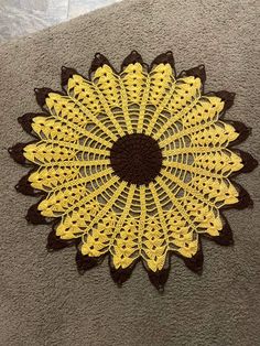 a crocheted doily is laying on the floor