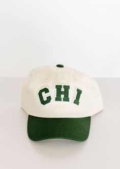 Rep Chicago with this two-tone, patched baseball hat. Baseball style, 6-panel design, curved brim, two-tone fabrication, "CHI" patched graphic, adjustable back This hat is the perfect way to add style to your mini's outfit. College Snapback Hat With Embroidered Logo And Curved Bill, Sporty Trucker Hat With Curved Brim For College, Curved Brim Snapback Hat With Embroidered Logo For College, Adjustable Curved Visor Trucker Hat For College, Collegiate Six-panel Adjustable Baseball Cap, Varsity Hats For Baseball Season, Collegiate Snapback Hat With Curved Bill, Adjustable Collegiate Six-panel Baseball Cap, Varsity Baseball Cap With Curved Brim