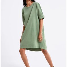 Zara Green Casual Dress With Button Detail Asymmetric Short Sleeve Size S This Short-Sleeved Sweatshirt Zara Dress Is On-Trend! Oversized But Not Baggy Fit. Can Fit In From Xs-L. Wear It Belted With Some Over The Knee Boots To Rock The "Lampshade" Trend. Can Also Be Paired Over A Pant/Legging/Tights. Can Transition Through All Seasons, Even Summer As This Is 100% Cotton. Loose-Fitting Short Sleeve Mini Dress With A Round Neckline, An Asymmetric Hem And Button Details On The Sleeves. 100% Cotton. Casual Shift Shirt Dress, Green Cotton Casual T-shirt Dress, Spring Cotton Shift Shirt Dress, Chic Cotton T-shirt Dress For Spring, Casual Crew Neck Dress With Relaxed Fit, Relaxed Fit Casual Dress With Crew Neck, Oversized Casual Dress For Day Out, Spring Oversized Cotton Midi Dress, Spring Green Cotton T-shirt Dress