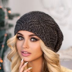 "Warm and cozy alpaca chunky knit gray slouchy beanie hat Trendy chunky knit warm slouchy hat - real decoration of the winter image of a woman. This stunningly beautiful with beautifully twisted around the edge volumetric beret is suitable for any age. This model adding flirty charm to the everyday image. Tam hat reliably warms his head from the cold. Chunky knit. Beret takes a good shape, does not sag. Season: Fall / Winter / Spring Cap length on average 11-11.1/2 \" Unlined Composition: mix al Winter Knit Crochet Hat, Trendy Knitted Gray Hat, Casual Winter Beanie As A Gift, Knitted Beanie One Size Fits Most, Winter Yarn Hat As Gift, Casual Winter Beanie As Gift, Winter Yarn Hats As Gifts, Casual Winter Beanie For Gift, Trendy Gray Knitted Hat