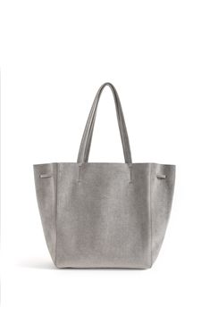 KWONN Shopper is made with vegan and sustainable performance fabric that's durable and easy to clean. The Shopper can be worn as a large shoulder bag or as a smaller size ​bucket bag by pulling the ​drawstring ​at the center of the bag. The exterior of the bag has a subtle shine coating, and the inner material features a softer texture with an uncanny suede feel. Each bag is handmade in New York by a master artisan. Fits up to 15" laptops. Ultra-lightweight, No lining, Hardware-free. Everlasting Grey Crossbody Bag, Grey Tote, Blue Tote, Large Shoulder Bags, Black Crossbody, Black Tote, Shopper Bag, Performance Fabric, Black Cross Body Bag