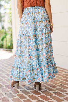 You are going to love when you get to start the day with this maxi skirt! That pattern is so pretty and we love the colors! This maxi skirt is perfect for the fall! Elastic waist Tiered Floral print No stretch Baileigh is wearing the small. Floral Long Skirt Light Blue, Bohemian Maxi Skirt With Elastic Waistband For Day Out, Blue Flowy Floral Print Bottoms, Vacation Gathered Maxi Skirt, Day Out Floral Print Maxi Skirt, Blue Maxi Skirt For Brunch, Blue Maxi Skirt With Elastic Waistband For Vacation, Bohemian Midi Skirt For Brunch, Blue Flowy Maxi Skirt With Elastic Waistband