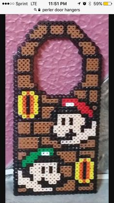 Luigi and Daisy Perler Frame | Luigi and daisy, Perler crafts, Bead sprite