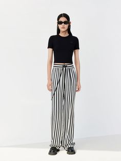 MO&Co. Women's Drawstring Striped Straight Pants Features : - Double side pocket design- Striped, wide leg with a straight fit- Elasticized waistband with a drawstring Code: MBC1PATT10The back length of size M is 107cmMATERIALS & CARE Material: 100% ViscoseNot water wash, do not bleachHang to dry in the shade, do not tumble dryLow temperature ironing pad, professional dry cleanPlease select your own size in the size chart according to your figure and serve model size as a guideline.REMINDER: All Ironing Pad, Style Pants, Vacation Style, Straight Pants, Color Stripes, Side Pocket, Pocket Design, Wide Leg, Size Chart