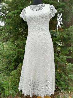 Handknitted lacedress, natural white. Based on Haapsalu lace stitch- patterns. Estonian lace.  Yarn: 100% merinowool Size: XS/S (EU) 34 - 36 (EU)  Every handknitted dress is unique.  You can be most certain, that no-one else has similar dress, as You.  There are 12 beads on the back of the dress.   Care: Hand wash in mild, lukewarm water detergent for delicate garments. Rinse. Gently squeeze out water, do not twist. Lay flat, stretch and fix with pins from the edges, let it dry. No ironing! Than Elegant Crochet Wedding Dress, Elegant Crochet Dress With Lace Work, Elegant Fitted Crochet Dress With Pointelle Knit, Elegant Crochet Lace Dress With Scalloped Details, Elegant White Crochet Dress, Elegant Crochet Dress With Pointelle Knit, Elegant Crochet Dress With Scalloped Lace For Wedding, Fitted Lace Crochet Dress For Wedding, Crochet Lace Dress For Wedding