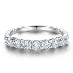 a white gold wedding band with five round cut diamonds on the top and bottom half