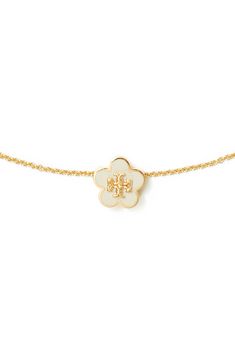 A flower-shaped logo medallion brings a pretty focal point for this delicate goldtone necklace. 16" length; 2" extender; 3/8" diameter pendant Goldtone plate/enamel Imported Evry Jewels Necklaces Stack, Cool Gold Necklaces, Enewton Necklace, Christmas List Items, Trendy Things, Tory Burch Necklace, Evry Jewels, Jewelry Stack, Cute Necklaces