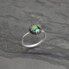 Dainty filagree handmade natural turquoise ring. Perfect on it's own or worn with your favorite stacking rings.  The turquoise is set in solid sterling silver on a solid sterling silver ring band.Turquoise is approximately 1/4" across (8mm).Choose which turquoise you would like from the drop down menu to the right and I will make a ring just for you.For more stacking rings:https://www.etsy.com/shop/kiraferrer?section_id=13894026To see my entire collection:https://www.etsy.com/shop/kiraferrer Adjustable Green Turquoise Chrysocolla Ring, Adjustable Turquoise Opal Ring, Adjustable Green Opal Bohemian Ring, Green Adjustable Bohemian Opal Ring, Bohemian Green Turquoise Ring As Gift, Bohemian Green Turquoise Ring Gift, Bohemian Green Opal Ring, Adjustable Turquoise Ring With Patina For Gift, Handmade Green Opal Bohemian Ring