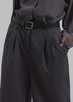 Color: Charcoal Midweight traditional suiting fabric Boxy fit Front pleat detailing Side seam pockets Back welt pockets Belt loops Zip fly Front button closure Unlined 70% Polyester 30% Rayon Dry Clean By The Frankie Shop. Imported Paris Store, Denim Suit, Frankie Shop, Suiting Fabric, Paris Woman, Pocket Belt, Charcoal Color, Swimwear Accessories, Welt Pocket