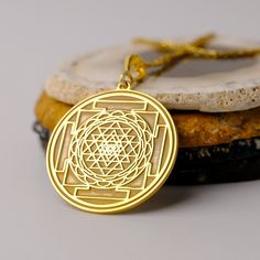 14K Gold Handmade Sri Yantra Necklace - Spiritual Gold Necklace, Sri Yantra Charm Necklace, It can be considered a spiritual gift. Pendant Details 💎 Gold KT: 14K Solid Gold or 8K Solid Gold 💎Gold Color Options: Yellow Gold, White Gold, Rose Gold 💎Thickness: 0.80 mm ✈️ Ready to Ship in 4-7 Business Days ✈️ Transportation is provided by express cargo MORE OF US Pendants and Necklaces: https://goldencastlejewelry.etsy.com NECESSARY INFORMATION 🧡 We provide workshop service in Ankara, we are hap Symbolic Jewelry For Navratri Rituals, Symbolic Jewelry For Navratri Puja, Symbolic Jewelry For Puja And Navratri, Round Temple Necklace For Navratri Gift, Navratri Gift Temple Necklace, Spiritual Round Pendant Necklace For Diwali, Temple Necklace With Round Pendant For Festival Gifts, Spiritual Locket Necklace For Navratri, Handmade Amulet Temple Necklace Gift