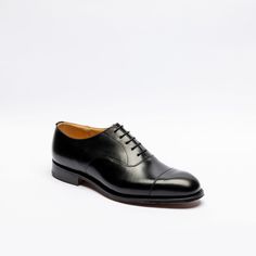 Black calf oxford shoe with stitched cap toe, leather inner lining and insole, Goodyear welted, single leather sole. Fitting G, last 173. Made in England Timeless Goodyear Welted Oxfords For Derby, Leather Oxfords With Leather Sole For Derby, Goodyear Welted Oxford Dress Shoes, Timeless Plain Toe Goodyear Welted Oxfords, Timeless Oxfords With Rubber Sole, Classic Goodyear Welted Lace-up Shoes, Classic Lace-up Oxford Shoes With Goodyear Welted, Timeless Goodyear Welted Plain Toe Oxfords, Classic Oxford Lace-up Shoes With Goodyear Welted