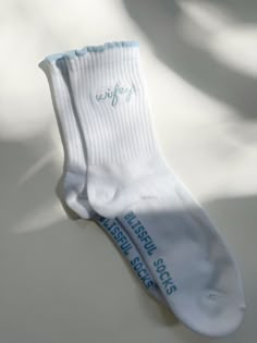 a pair of white socks sitting on top of a table