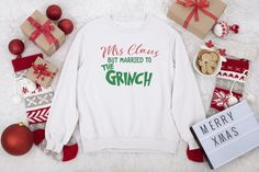 Mrs. Claus But Married to the Grinch Sweatshirt (Adult) Custom Request Information If you would like a different color shirt, please indicate your request in the cart Special instructions for seller field. We will do our best to accommodate realistic requests. Custom requests may require additional processing time. Care Instructions (non-custom) : Use cold water Do not utilize dye Do not bleach Wash dark & bright colors separately Tumble dry at low heat settings Warm Iron Care Instructions (cust Disney Shirts Christmas, Hoodies Photoshoot, Married To The Grinch, Disney Vacation Outfits, Christmas Apparel, Christmas Crewneck, Xmas Sweater, Holiday Sweatshirt, Cute Sweatshirts