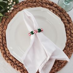 a white plate topped with a candy cane napkin