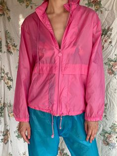 "Gender neutral hoodie swishy windbreaker. Maybe a little water proof? For the pants: https://www.etsy.com/listing/1234578829/1980s-swishy-pants-semi-sheer-blue?click_key=d3c7f4732e47c36718ea664fb43eae5b37f7b3c6%3A1234578829&click_sum=2efbb960&ref=shop_home_active_4 Bust: 44\" Circa: 1980's Condition: Good vintage condition. Normal wear. Follow us on Instagram for the latest----> http://instagram.com/closetcasevintage @closetcasevintage Please read our store policies." Neutral Hoodie, Oversized Hooded Jacket, Swishy Pants, Pink Windbreaker, Rose Bonbon, Parka Jacket, Bubblegum Pink, Water Proof, Hooded Jacket