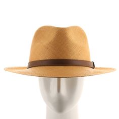 ↑ Click above to watch the video! ↑ Malta Sienna is a modern fedora with a tall hand-blocked teardrop crown that features a stiffened medium brim, sleek leather strap hatband, and beautiful sienna-colored straw. The brim contains a wire to hold its shape. This item is a genuine Panama Hat handwoven in Ecuador. Material: 100% Toquilla StrawBrim: 2 3/4"Crown: 4 1/2" teardropHatband: 5/8" leatherClimate: Sun Handwoven in Ecuador. Hand-finished in the US. Measurements are approximate, this is a hand Everyday Leather Fedora With Flat Brim, Everyday Leather Brimmed Fedora, Leather Brimmed Fedora For Everyday Wear, Luxury Flat Brim Fedora For Spring, Modern Fedora With Short Brim For Everyday, Classic Brown Fedora With Flat Crown, Everyday Leather Fedora With Curved Brim, Brown Flat Brim Hat With Leather Lining, Fitted Brown Panama Hat With Flat Crown