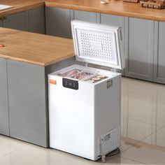 an ice chest in the middle of a kitchen