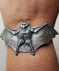 Bat, Bat cuff, Bat bracelet, Bat cuff, Bat jewelry, Goth, Gothic,Horror, Horror jewelry Bat bracelet fits 6 to 8 size wrist Need it bigger put it in the notes Toggle clasp Super cute Bat Bracelet, Horror Jewelry, Tiki Wedding, Bat Jewelry, Jewelry Goth, Horn Headband, Gothic Horror, Small Charms, Silver Charm Bracelet