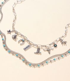 "Boutique By BKE 2 Pack Western Necklace Set - Silver 14-19;20-25, Women's Silver Multi charm necklace length measures 18" Bead and chain layered necklace length measures 20". Apparel & Accessories" Trendy Multi-strand Metal Charm Necklaces, Trendy Silver Charm Necklace With Beaded Chain, Trendy Silver Beaded Chain Charm Necklace, Chain Layered Necklace, Western Necklace, Buckle Necklace, Silver Diamond Bracelet, Western Necklaces, Western Belt Buckles