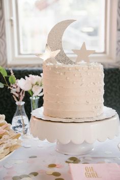 a white cake sitting on top of a table