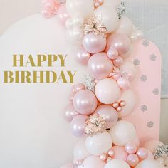 a happy birthday card with balloons and snowflakes on the top, in gold foil lettering