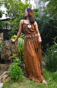 Introducing our Pari Vintage Vibe Brown Top & Maxi Skirt, perfect for embracing boho hippie vibes! This stunning set includes a maxi skirt with a pleated border that adds a touch of elegance and offers a chic, comfortable fit. Crafted with comfort yet elegant fashion in mind, this ensemble is ideal for creating enchanting looks. Choose between two top variations: a halter top or a smocked top, both designed to complement the flowing silhouette of the skirt. Available in various sizes, this set c Hippie Flowy Boho Print Maxi Skirt, Flowy Boho Print Hippie Maxi Skirt, Hippie Boho Print Maxi Skirt For Festivals, Festival Boho Print Maxi Skirt In Hippie Style, Festival Boho Print Maxi Skirt Hippie Style, Festival Hippie Maxi Skirt With Boho Print, Festival Hippie Boho Print Maxi Skirt, Hippie Floor-length Maxi Dress, Bohemian Tiered Maxi Skirt