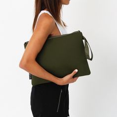 Meet the Oversized Neoprene Pouch—your new go-to accessory for work and play! This sleek pouch easily fits both 13-inch and 14-inch laptops, but it’s not all business, with enough room for your tech and a few essentials (like your phone and favorite lip balm), it's perfect for those busy days that turn into spontaneous evenings, or even for a beach weekend, and city outings! With a wristlet strap for easy carrying this oversized neoprene pouch is crafted from durable, lightweight, machine washab Green Shoulder Bag Pouch For Daily Use, Green Laptop Bag With Luggage Sleeve, Green Shoulder Bag Pouch For Everyday, Green Laptop Bag With Luggage Sleeve For Everyday Use, Everyday Green Bag With Luggage Sleeve, Trendy Everyday Laptop Bag With Sleeve, Green Zipper Travel Pouch, Green Shoulder Bag With Laptop Sleeve For Everyday Use, Everyday Green Bags With Luggage Sleeve